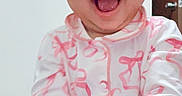 Raniah is registered to the contest to win money with this photo: baby, carpet, child, cute, door, face, hands, happy, indoor, infant, joyful, laughing, pajamas, pink, portrait, sitting, smiling, wall, white, young_child