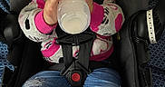 Raniah is registered to the contest to win money with this photo: baby, bottle, car_seat, child, clothing, cozy, face, feeding, harness, hood, indoors, infant, jeans, outfit, passenger, pink, portrait, sitting, vehicle, white