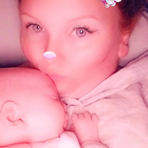 Lily is registered to the contest to win money with this photo: beauty, bedtime, cheek, child, chin, close_up, eye, face, forehead, head, infant, lip, mother, mouth, nose, person, pink, product, skin, sleep