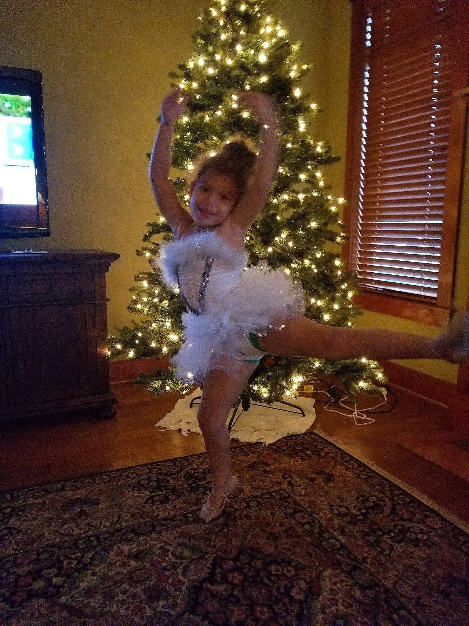 Aiyanna is registered to the contest to win money with this photo: christmas, christmas_decoration, christmas_tree, costume, dance, dancer, dress, event, fun, girl, holiday, joy, lighting, performance_art, performing_arts, person