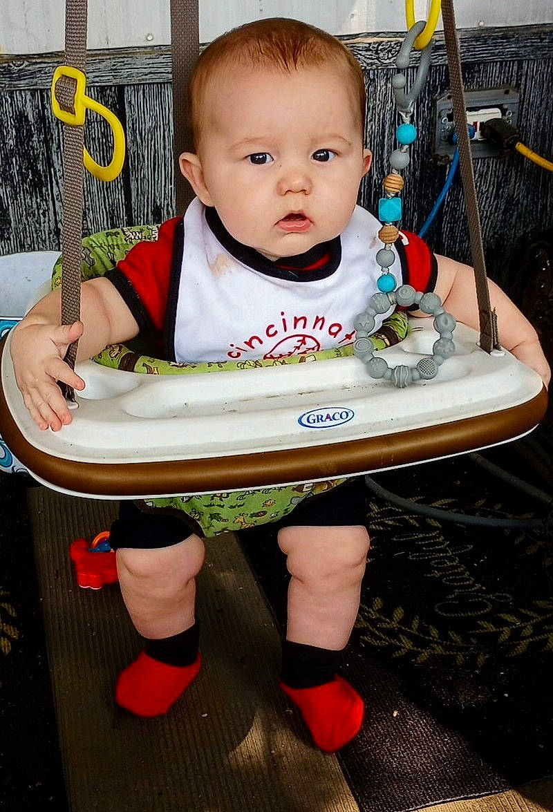 Dallas is registered to the contest to win money with this photo: automotive_tire, baby, baby_products, baby_toddler_clothing, carmine, chair, child, flooring, fun, happy, human_leg, knee, person, shoe, sitting, sleeve, sneakers, t_shirt, thigh, tire