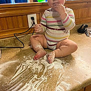 Stella joined the competition — help win amazing prizes! baby, bodypart, cooking, cream, dessert, diaper, dough, face, finger, food, hand, head, indoors, kneadingdough, person, photography, plywood, portrait, powder, wood