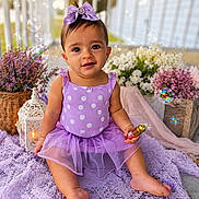 Brittany joined the competition — help win amazing prizes! baby, child, purple_dress, bow, polka_dot, sitting, blanket, flowers, bubbles, smile, cute, outdoor, lantern, decor, toddler, portrait, playful, happy, skin, person