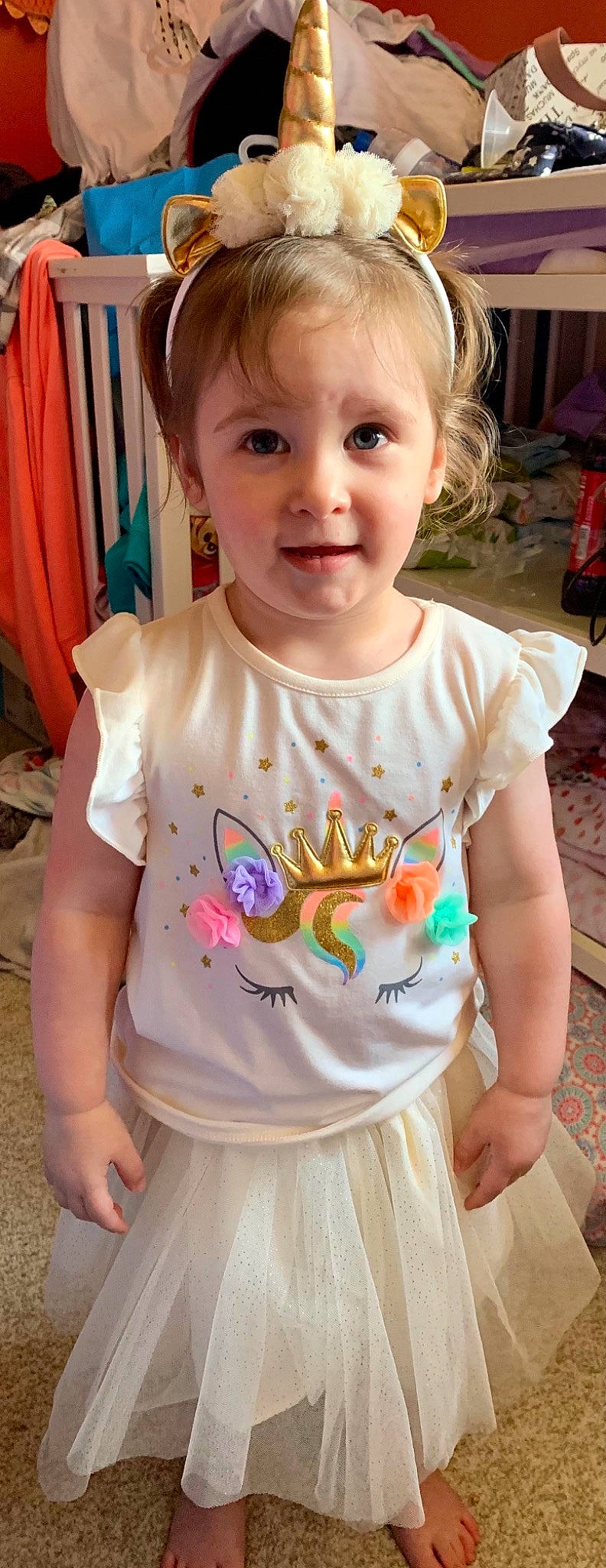 Everleigh is registered to the contest to win money with this photo: arm, baby, baby_toddler_clothing, cheek, child, clothing, dress, hairstyle, happy, iris, neck, organ, person, pink, shoulder, skin, sleeve, smile, standing, toddler