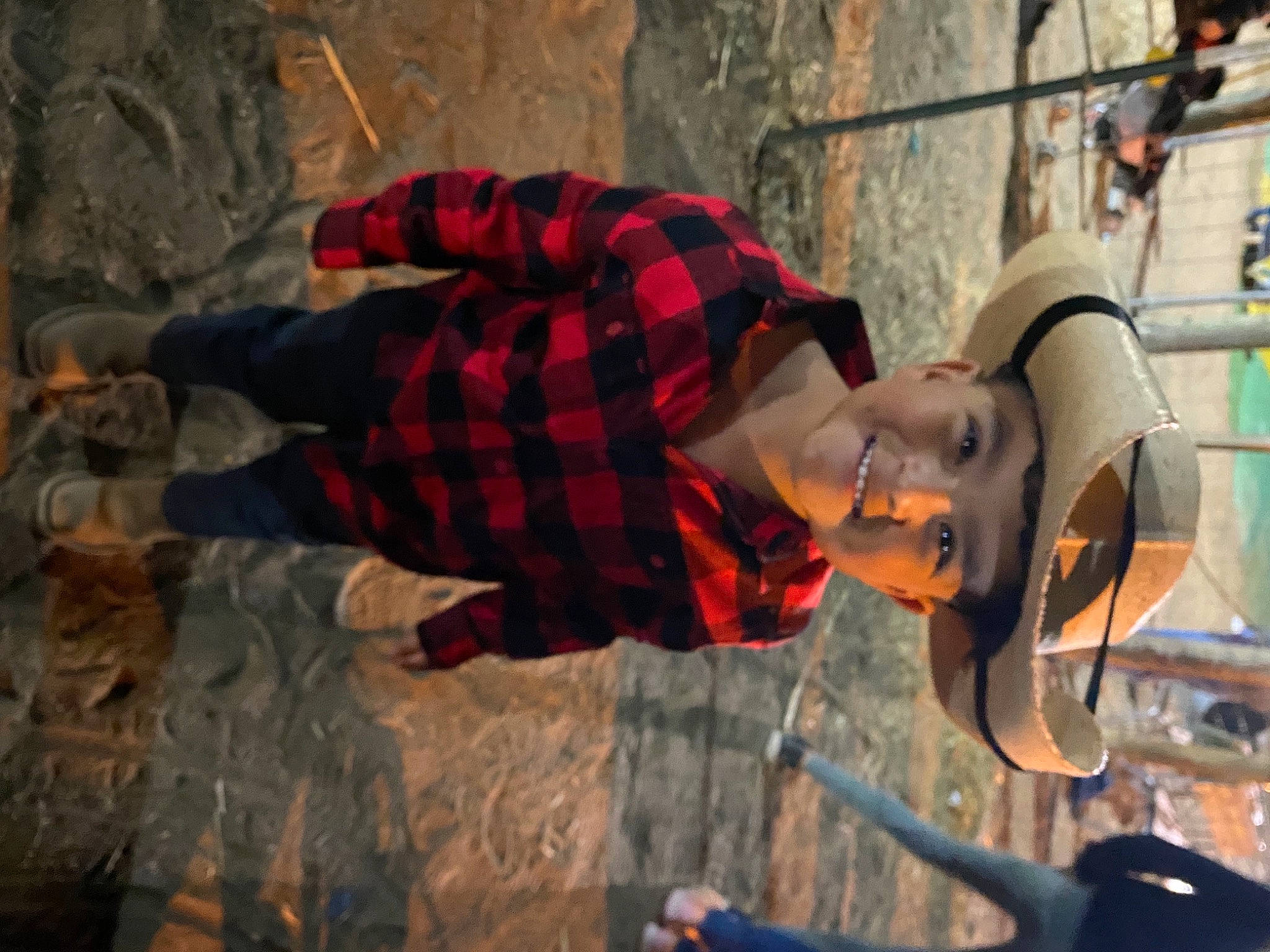 Lionel is registered to the contest to win money with this photo: adventure, child, entertainment, event, fun, hat, headgear, headwear, joy, leisure, metal, music, musician, orange, pattern, performing_arts, person, plaid, recreation, rope