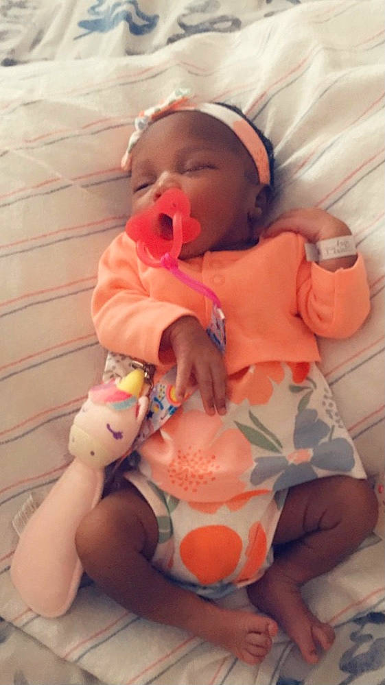 Jesslyn is registered to the contest to win money with this photo: abdomen, baby, baby_products, baby_sleeping, baby_toddler_clothing, cheek, chest, child, comfort, finger, knee, mouth, orange, person, pink, skin, sleeve, stomach, thigh, toddler