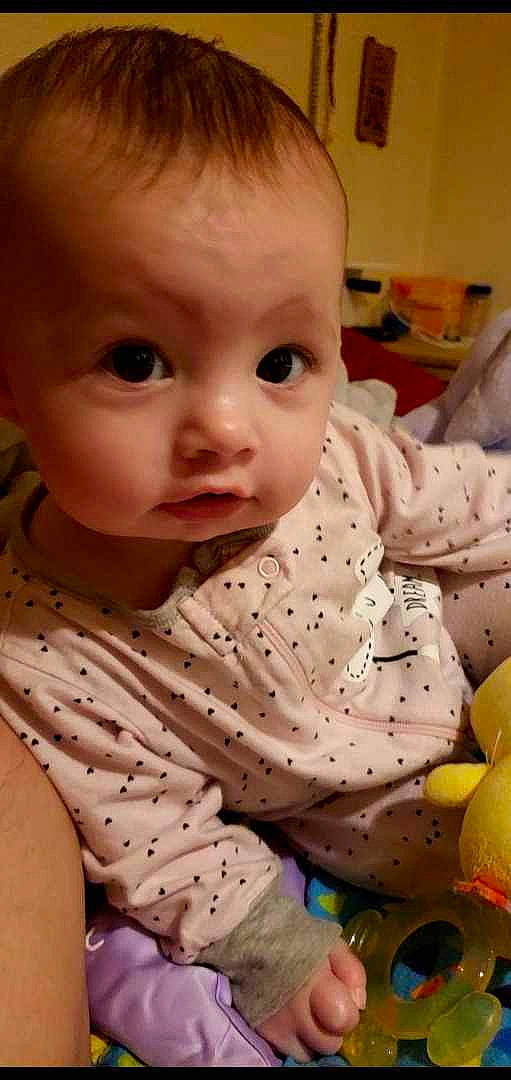 Marlee joined the competition — help win amazing prizes! arm, baby, baby_toddler_clothing, cheek, child, chin, collar, dress, eye, eyelash, flooring, human_body, iris, lip, mouth, nose, pattern, person, skin, sleeve