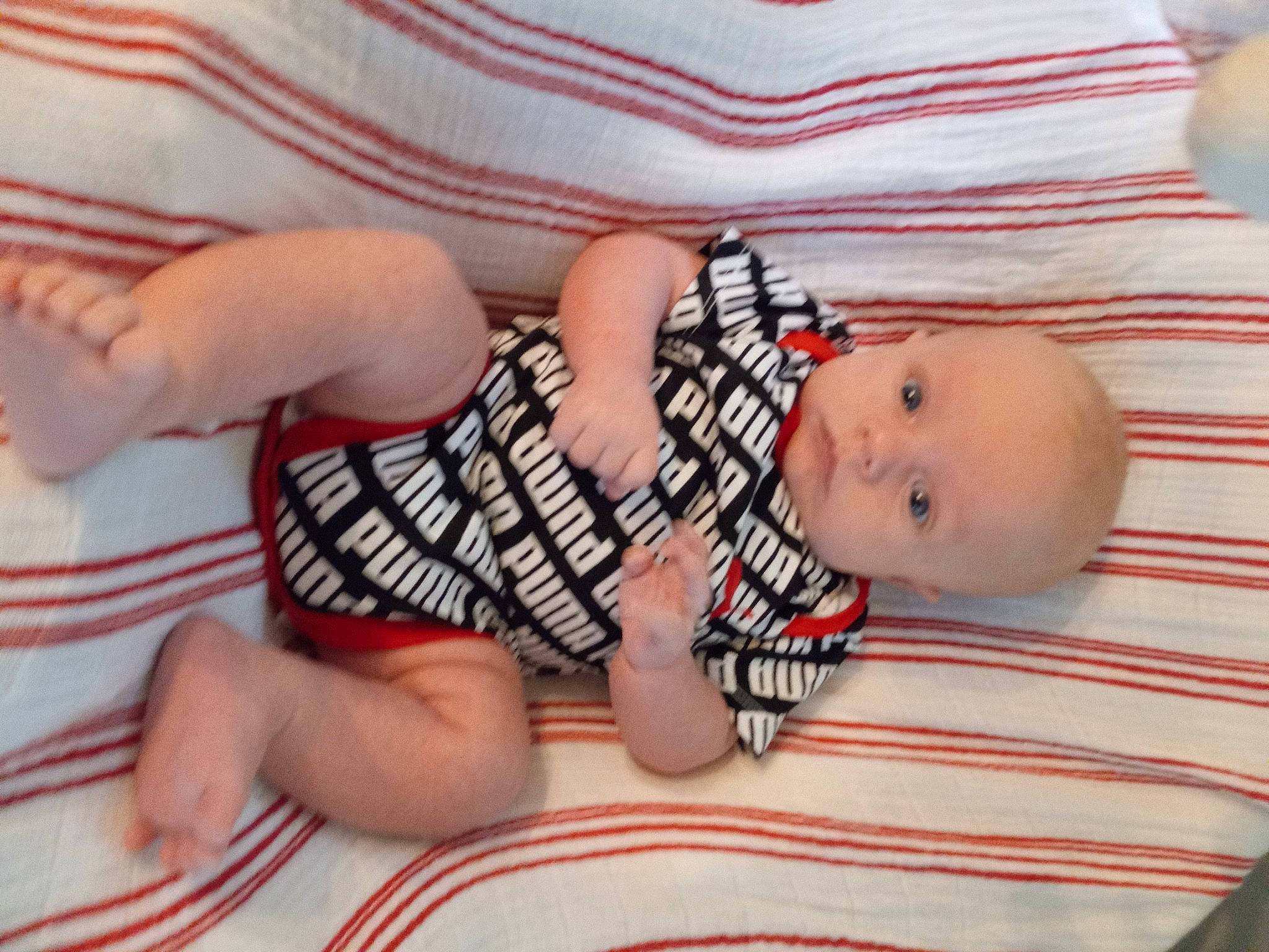 Callahan joined the competition — help win amazing prizes! arm, baby, baby_products, baby_toddler_clothing, child, comfort, finger, head, human_body, joint, lip, mouth, nail, pattern, person, skin, sleeve, textile, thumb, toddler