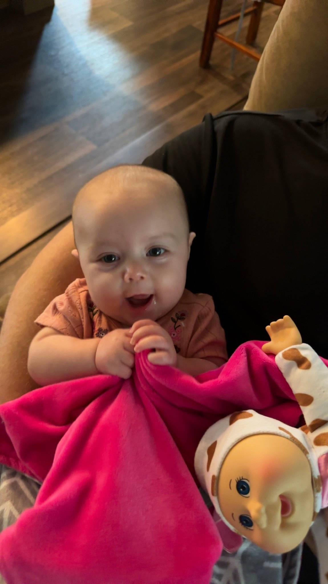 Wrenlye is registered to the contest to win money with this photo: baby, baby_toddler_clothing, beauty, cheek, child, chin, comfort, doll, event, flooring, fun, happy, human_body, mouth, person, pink, skin, smile, toddler, toy