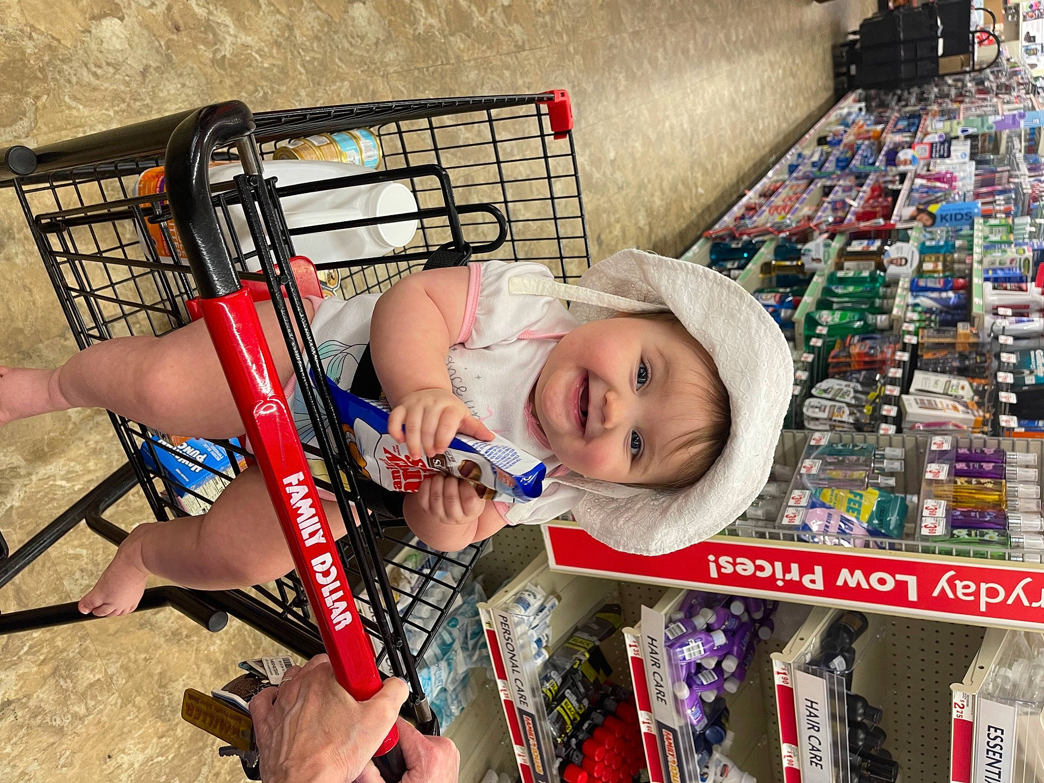 Ripley is registered to the contest to win money with this photo: child, convenience_store, fun, headwear, joy, leisure, people, person, photograph, play, product, public_space, publication, retail, shelf, shelving, shopping, smile, snapshot, t_shirt