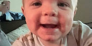 Oliver is registered to the contest to win money with this photo: baby, face, smile, child, indoor, person, closeup, cute, joy, infant, expression, hand, cozy, home, clothing, cheek, happy, young, portrait, curious