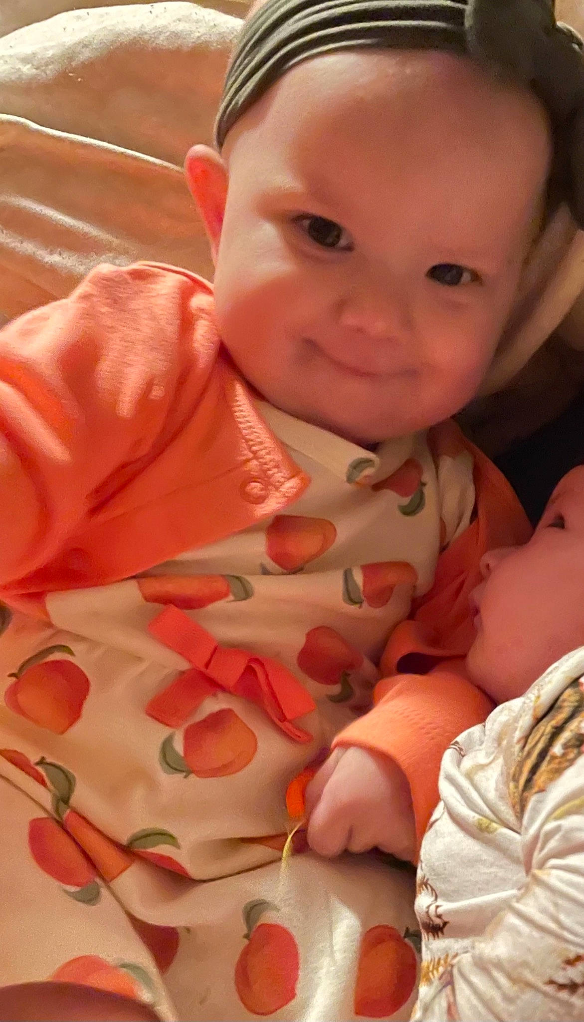 Isabella joined the competition — help win amazing prizes! arm, baby_toddler_clothing, cheek, chin, comfort, eye, face, happy, head, human_body, lip, mouth, nose, orange, organ, person, pink, skin, sleeve, smile