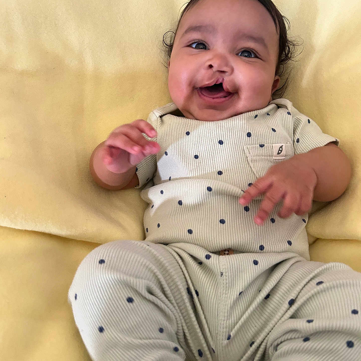 Cataleya is registered to the contest to win money with this photo: baby, babylaughing, bed, bodypart, clothing, cushion, face, furniture, happy, head, homedecor, laughing, mouth, newborn, pajamas, pants, person, photography, portrait, smile