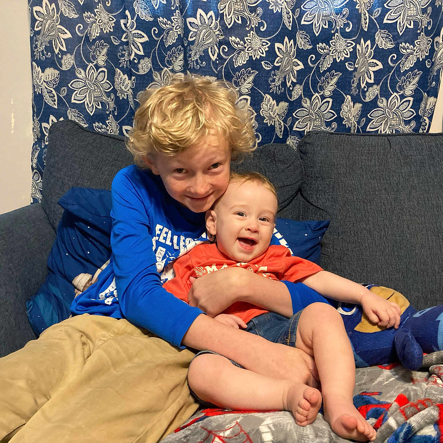 Andrew is registered to the contest to win money with this photo: ball, boy, child, clothing, couch, cushion, face, football, furniture, happy, head, homedecor, male, pants, people, person, photography, portrait, soccer, t_shirt