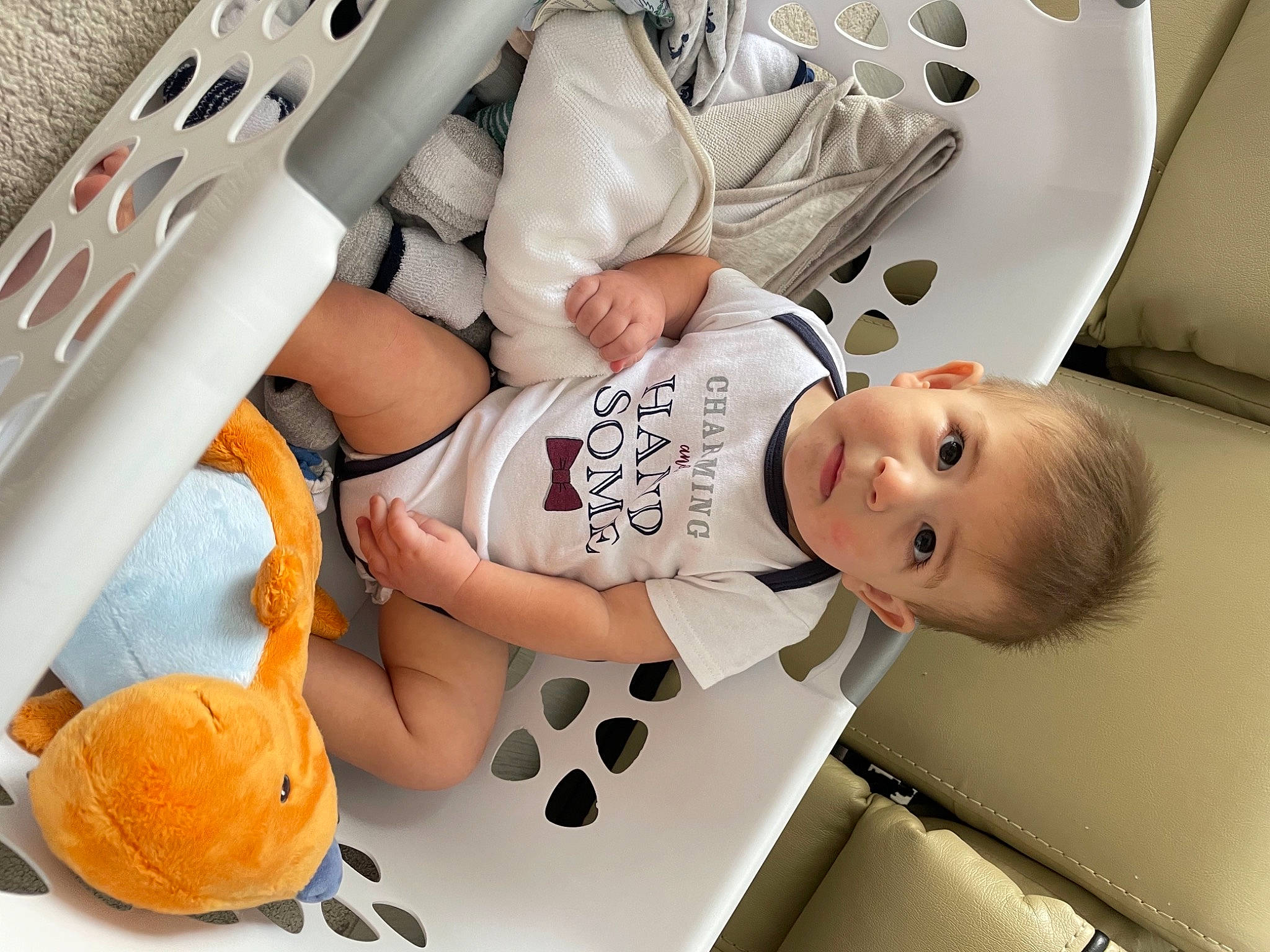 Nicholas is registered to the contest to win money with this photo: baby, calabaza, carmine, child, comfort, computer_keyboard, head, home_appliance, laundry_room, major_appliance, mammal, mouth, office_supplies, orange, organ, person, room, t_shirt, thumb, toddler
