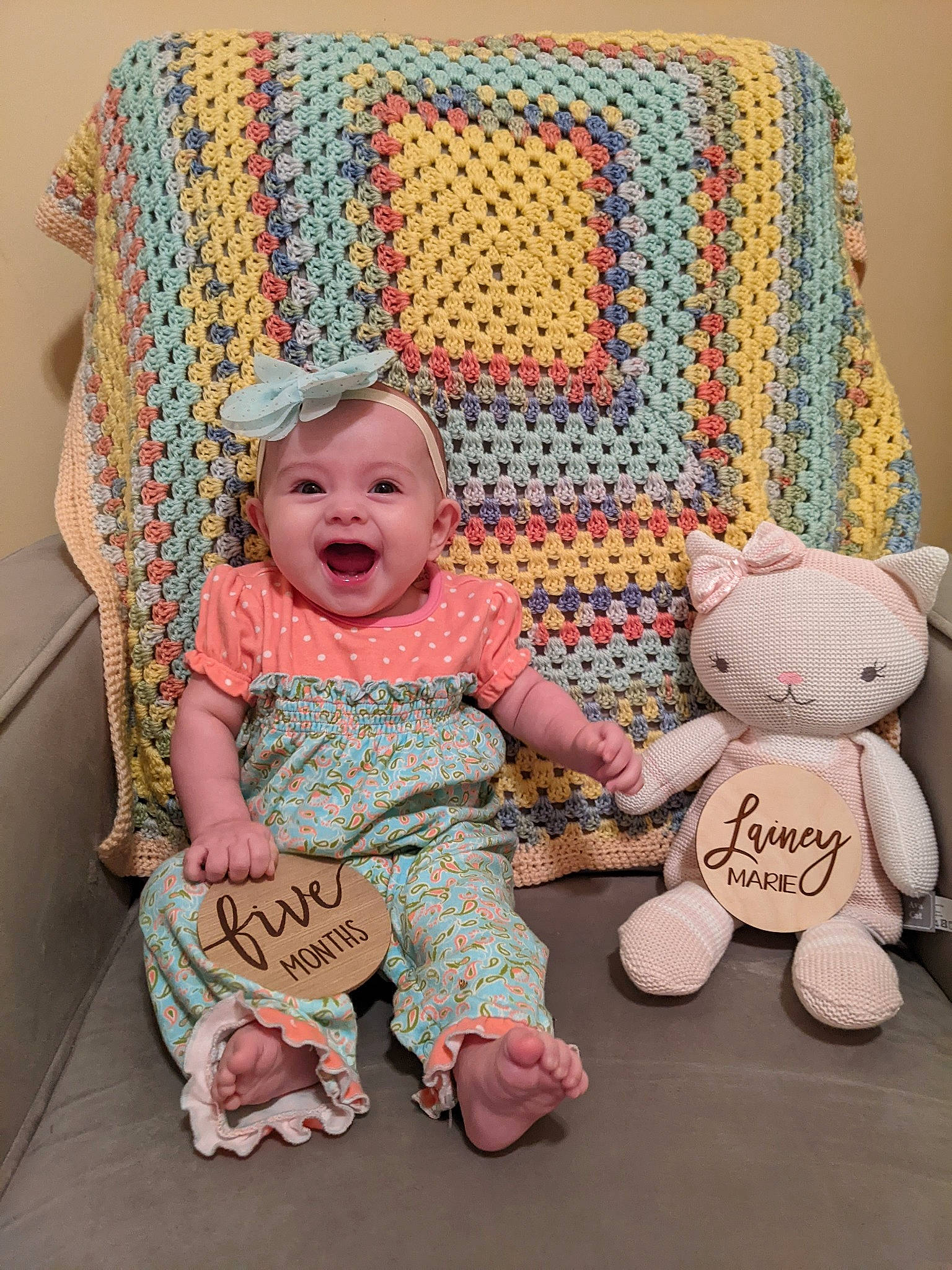 Lainey joined the competition — help win amazing prizes! baby, baby_toddler_clothing, chair, child, comfort, couch, face, furniture, head, infant_bed, linens, pattern, person, product, sitting, skin, sleeve, smile, textile, toddler