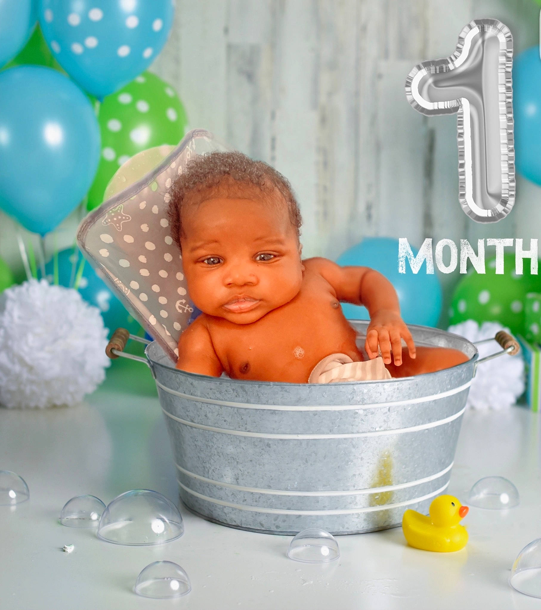 Hassan is registered to the contest to win money with this photo: aqua, azure, baby, baby_bathing, baby_products, balloon, bathing, blue, chest, child, dishware, event, facial_expression, fun, green, happy, person, serveware, tableware, toddler