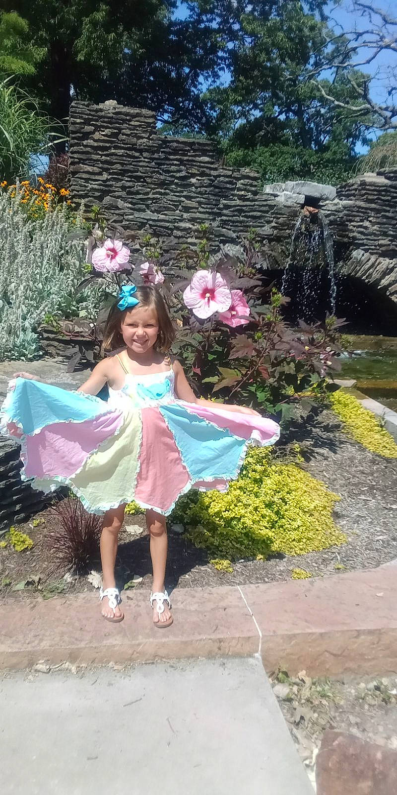 Serenity is registered to the contest to win money with this photo: botany, event, fashion_accessory, flower, fun, garden, grass, happy, joy, leaf, leisure, magenta, people_in_nature, person, pink, plant, pole, recreation, shrub, smile