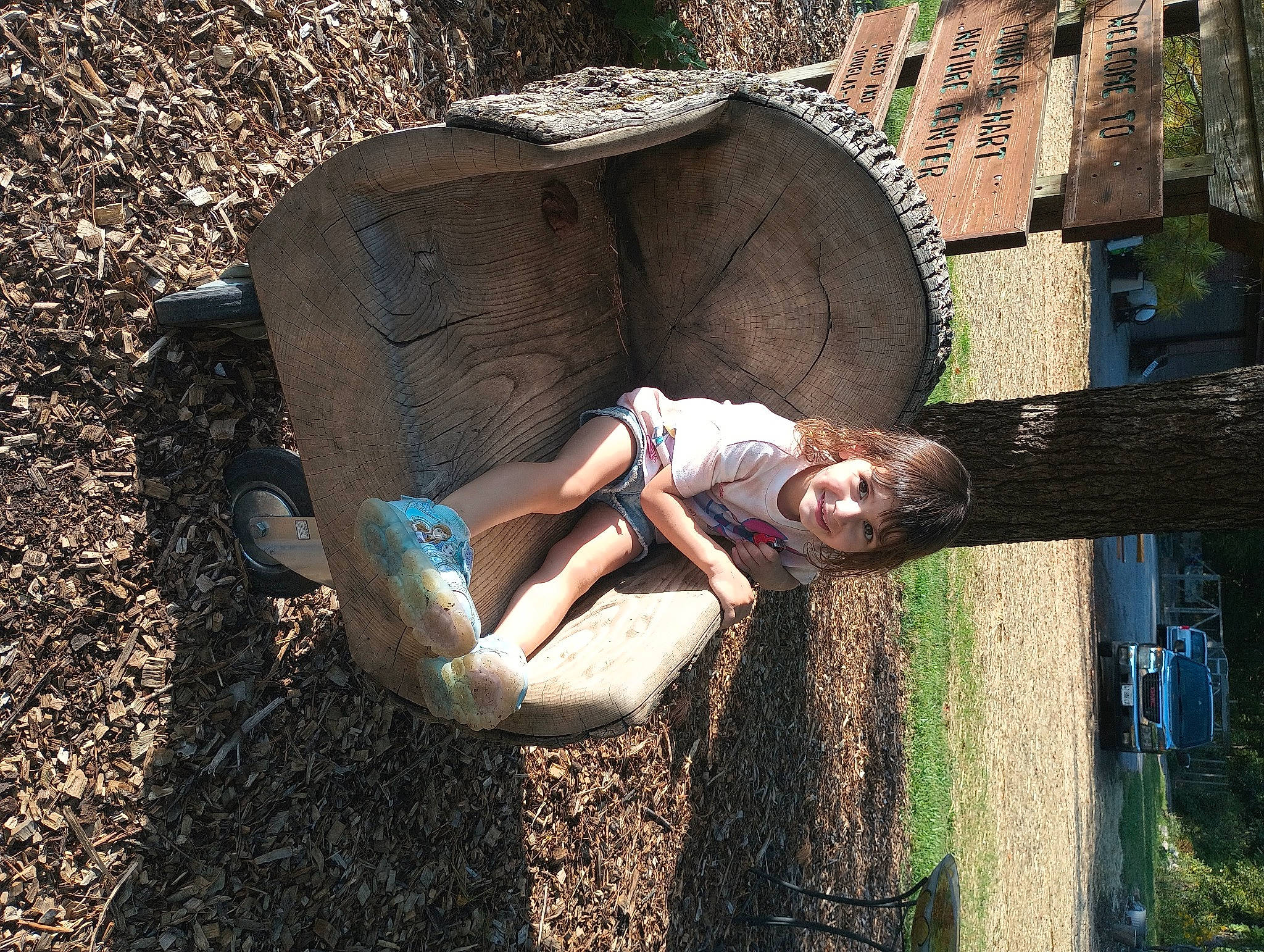 Adelynn joined the competition — help win amazing prizes! flash_photography, fun, grass, grass_family, happy, human_leg, joy, landscape, leisure, people_in_nature, person, recreation, shadow, sitting, soil, thigh, tints_and_shades, tree, trunk, wood