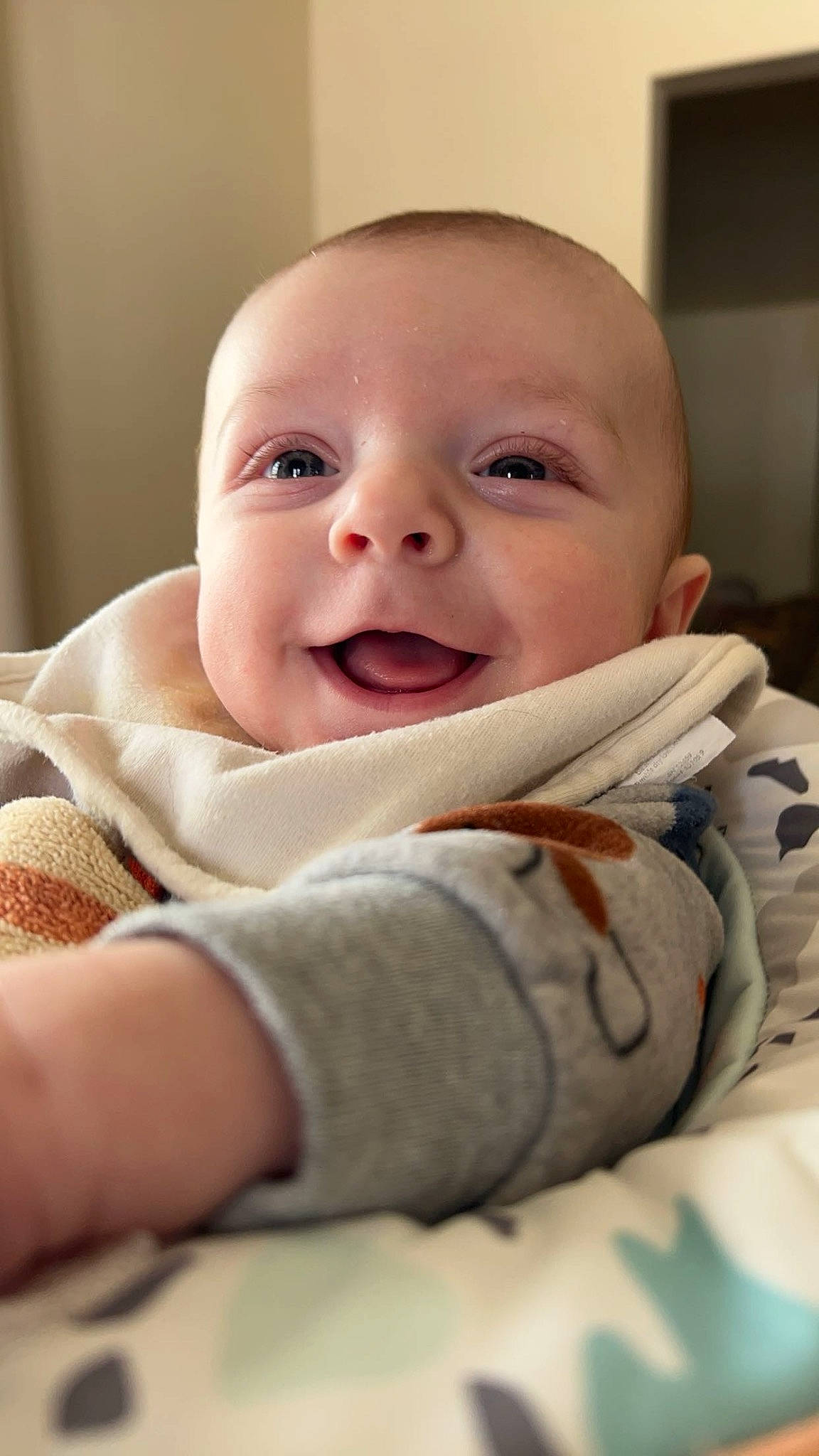 Colby is registered to the contest to win money with this photo: baby, baby_making_funny_faces, baby_products, baby_toddler_clothing, cheek, child, comfort, eye, happy, laugh, linens, lip, person, room, sitting, skin, sleeve, smile, thumb, toddler