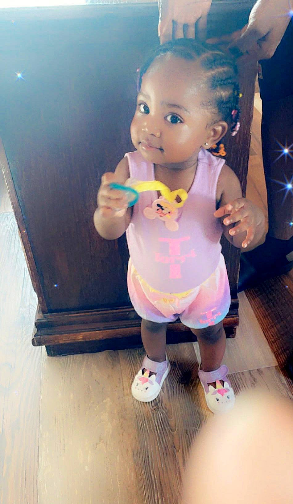 Torri is registered to the contest to win money with this photo: baby, baby_toddler_clothing, child, doll, flooring, fun, happy, human_leg, knee, magenta, person, pink, sandal, selfie, shorts, sitting, sock, t_shirt, thigh, toddler