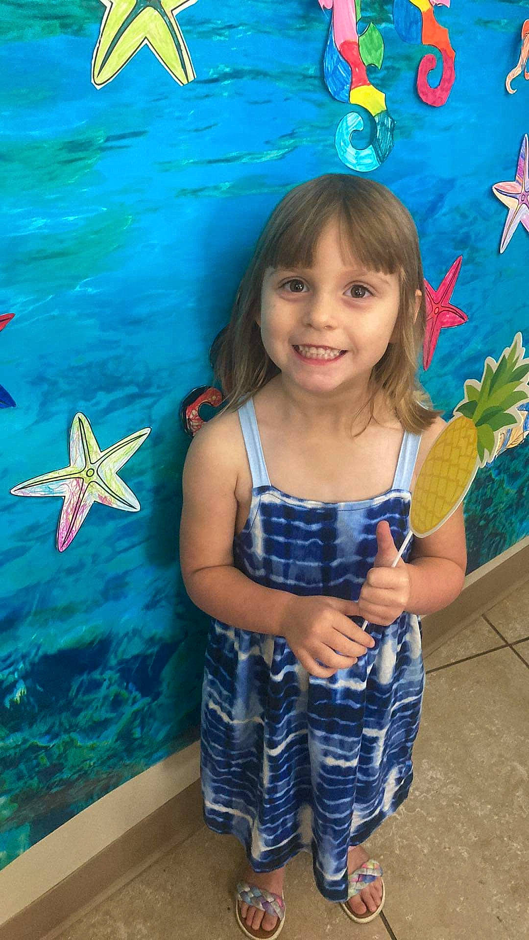 Carolyn is registered to the contest to win money with this photo: art, azure, baby_toddler_clothing, beauty, blue, child, electric_blue, facial_expression, fun, happy, joy, leisure, organ, pattern, person, shorts, smile, summer, t_shirt, textile