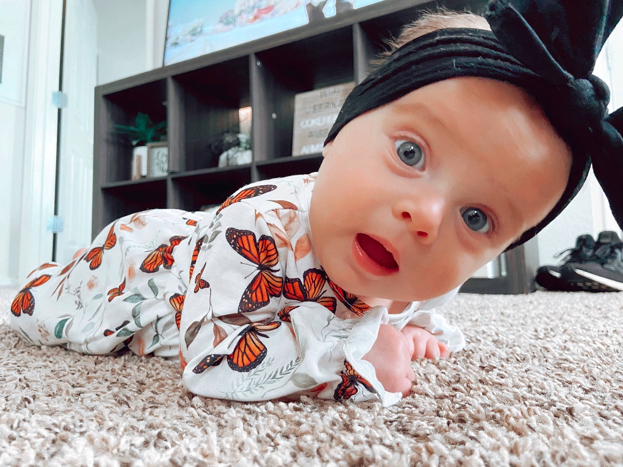 Everly joined the competition — help win amazing prizes! baby, baby_toddler_clothing, cap, carmine, cheek, child, chin, eye, fashion_accessory, flooring, foot, fun, happy, hat, headwear, mouth, nose, person, room, sitting