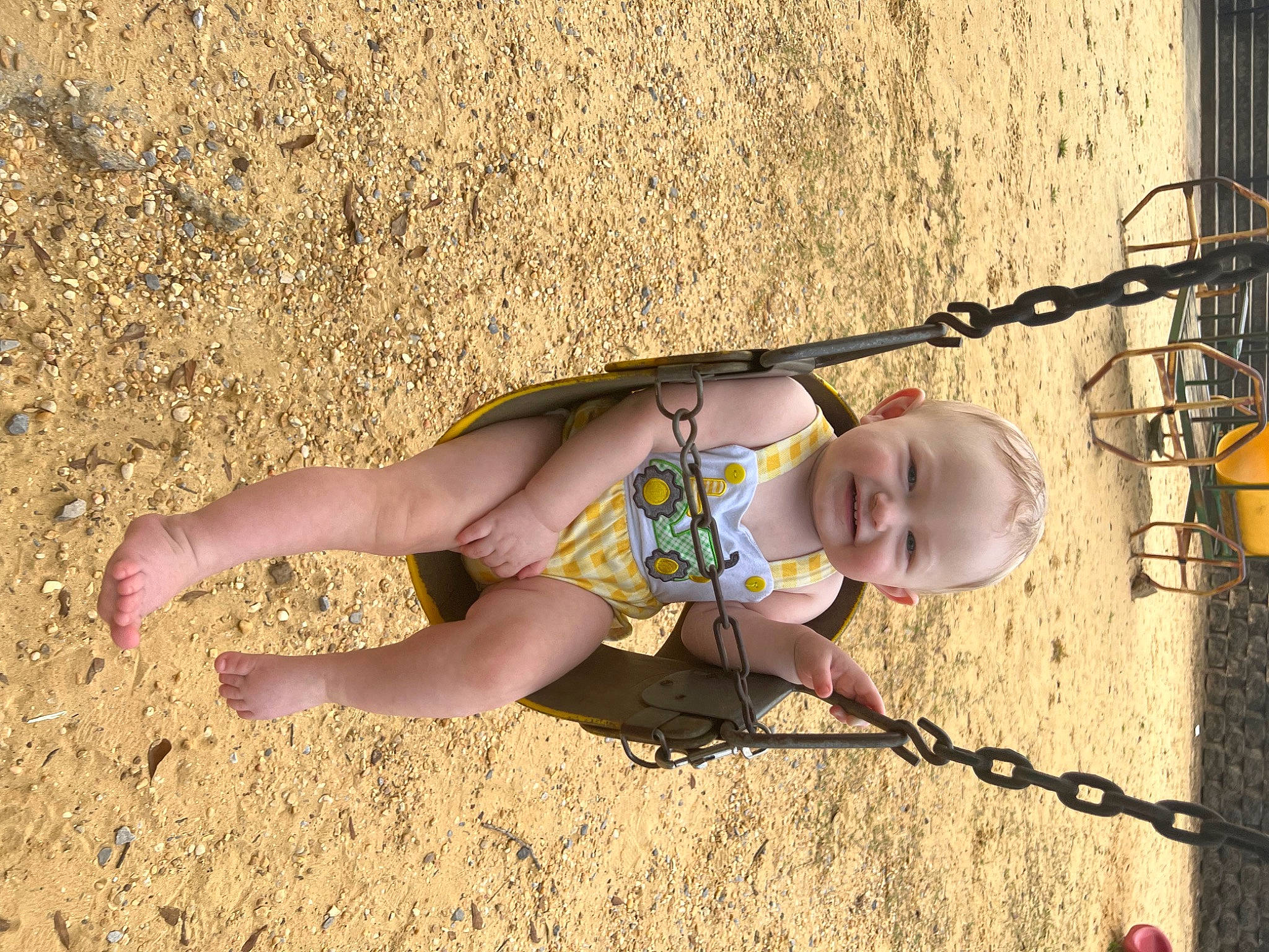 Ryder is registered to the contest to win money with this photo: baby, child, eyewear, foot, fun, grass, happy, human_leg, joy, knee, landscape, leg, leisure, people_in_nature, person, sand, shadow, sitting, smile, thigh