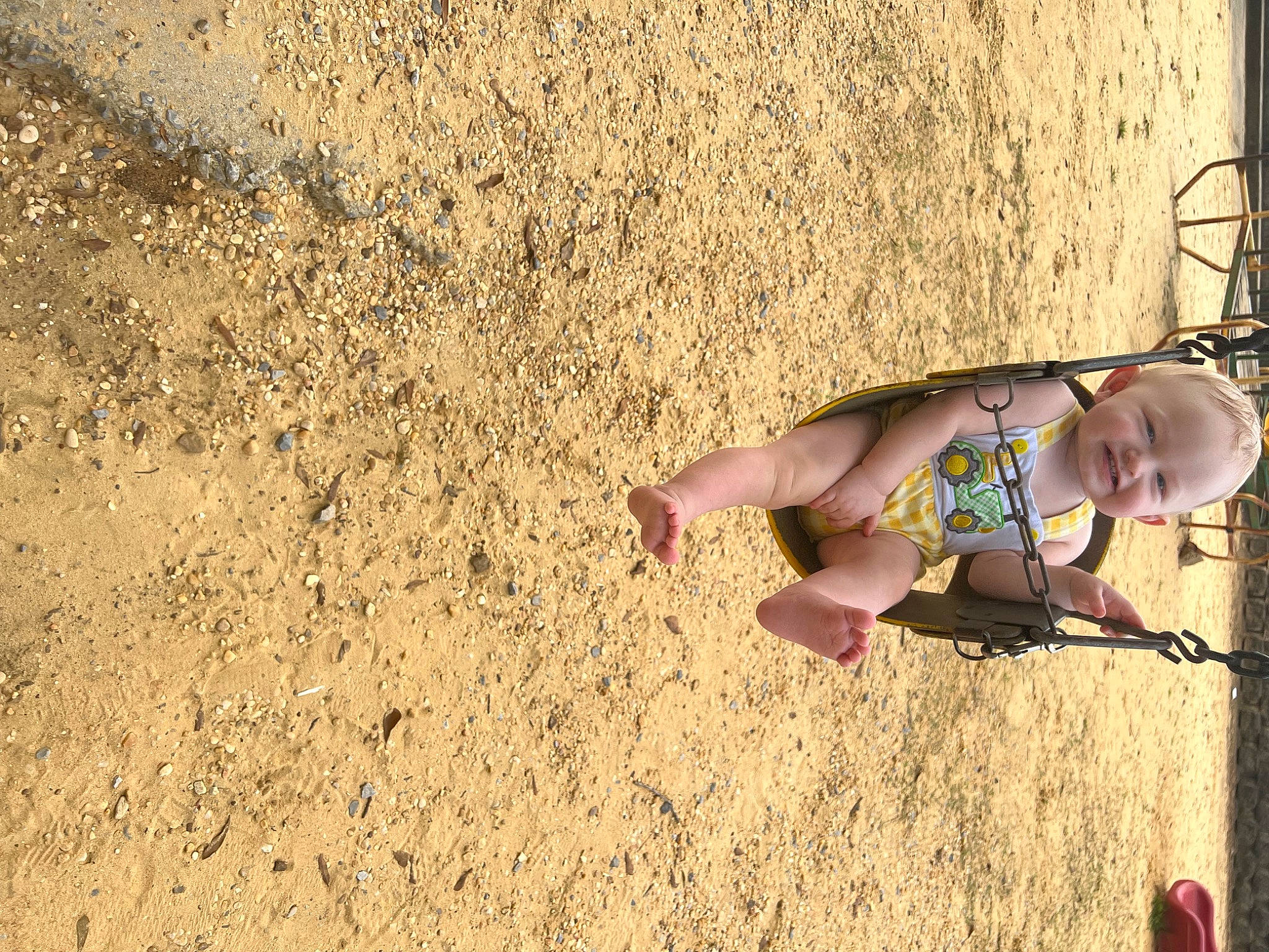 Ryder is registered to the contest to win money with this photo: baby, beach, child, foot, fun, grass, happy, human_leg, joy, landscape, leisure, people_in_nature, person, recreation, sand, shadow, soil, swing, thigh, toddler