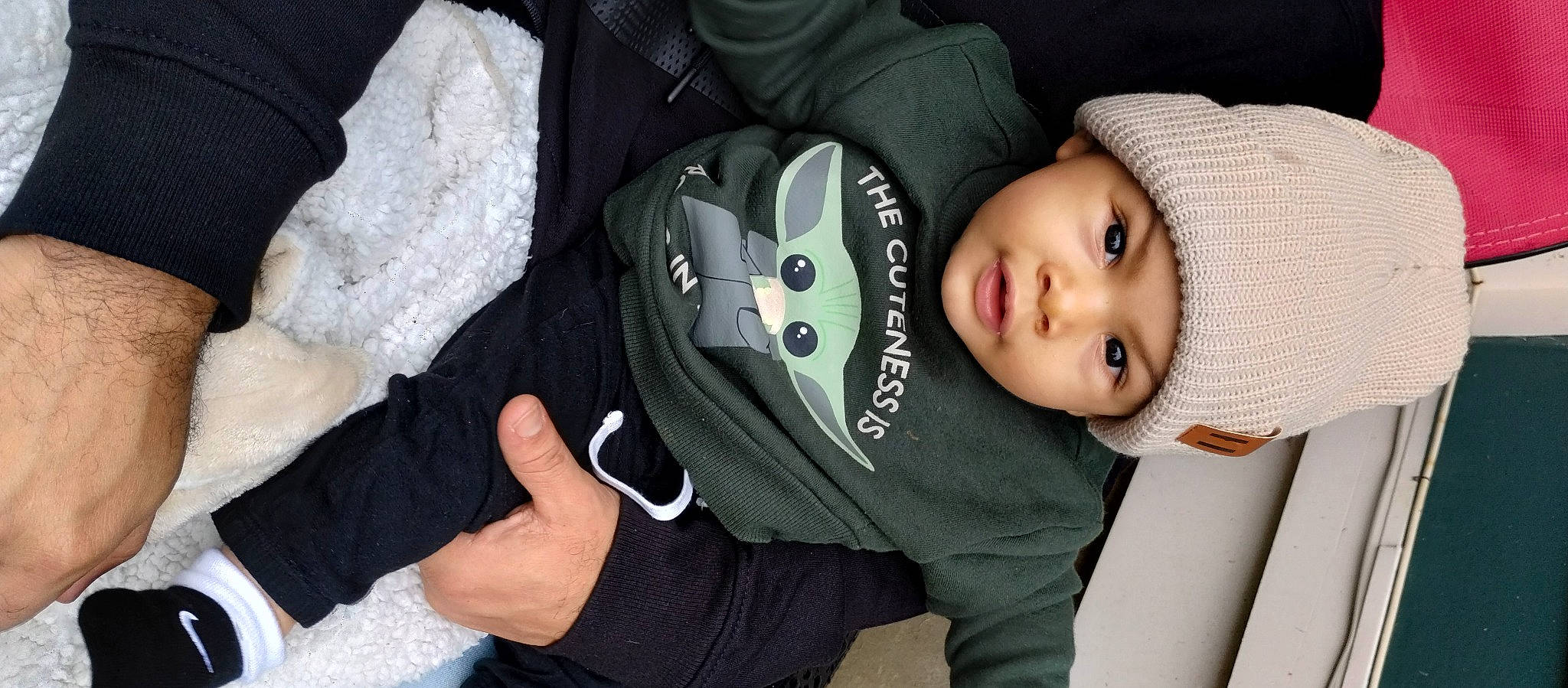 Onan Joniel is registered to the contest to win money with this photo: auto_part, baby, baby_carriage, baby_products, baby_safety, baby_toddler_clothing, cheek, child, collar, comfort, eye, eyelash, finger, hat, headgear, headwear, person, personal_protective_equipment, sitting, sleeve