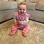 baby, carpet, child, cozy, cushion, cute, face, floor, furniture, happy, home, indoor, infant, person, pink_clothing, plush, sitting, smiling, sofa, toddler