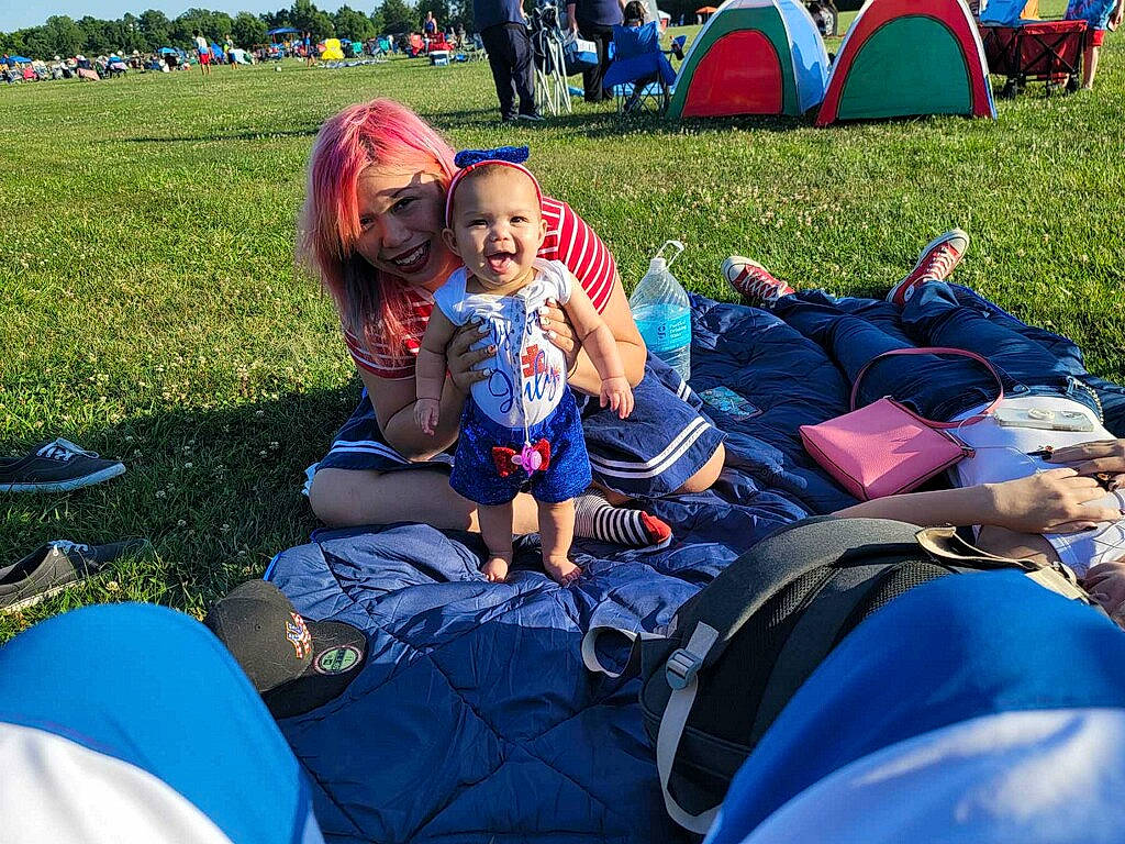 Arabelle is registered to the contest to win money with this photo: blue, crowd, fun, grass, happy, joy, leaf, leisure, light, outdoor_recreation, people, person, photograph, recreation, shoe, shorts, smile, sneakers, style, summer