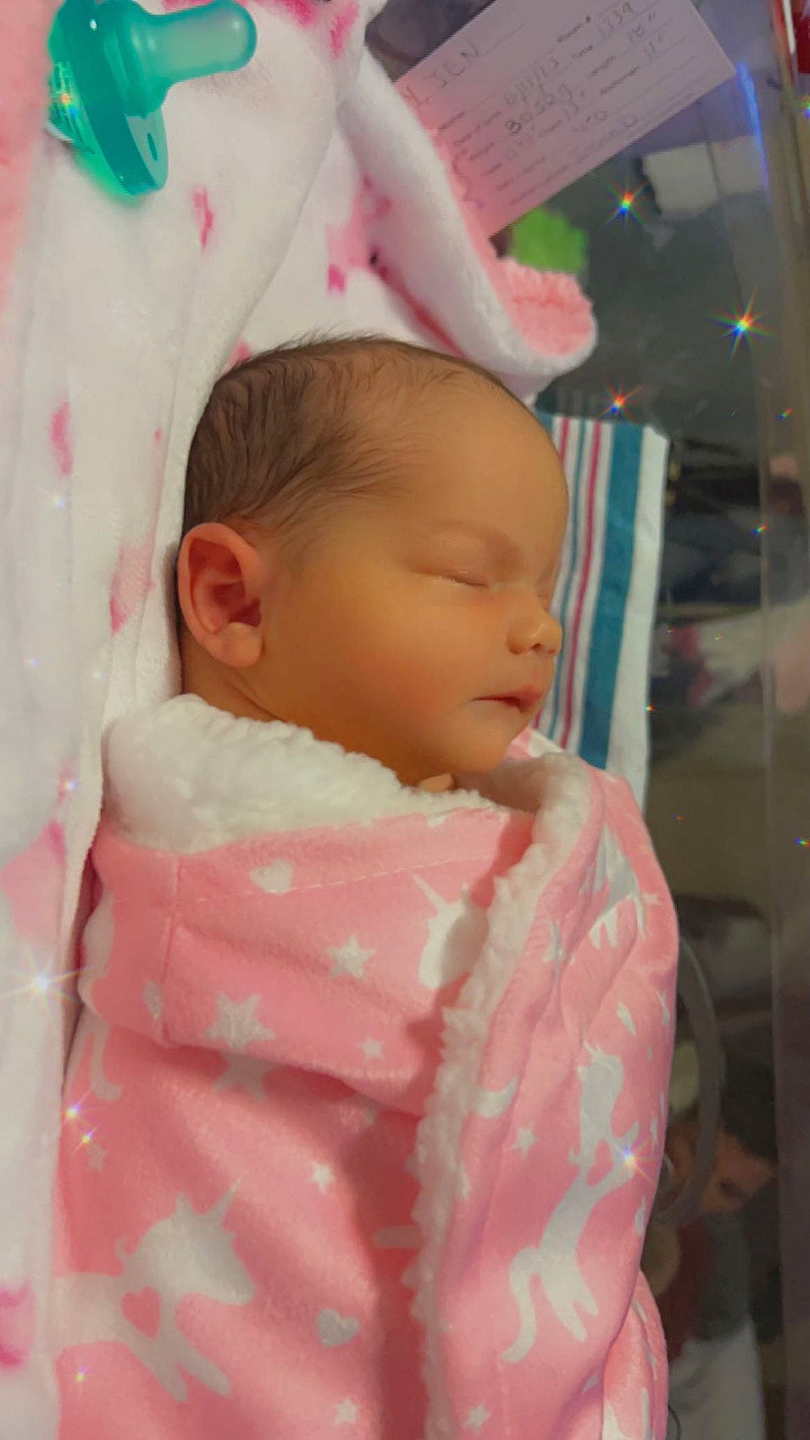 Mia is registered to the contest to win money with this photo: baby, baby_products, baby_sleeping, baby_toddler_clothing, cheek, child, comfort, eyebrow, eyelash, iris, linens, lip, neck, nose, pattern, person, pink, room, skin, sleeve