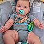 Westley joined the competition — help win amazing prizes! baby, child, pacifier, onesie, baby_seat, blanket, toy, blue_eyes, curly_hair, skin, foot, hand, wooden_floor, clothing, infant, cute, indoor, comfort, expression, seated