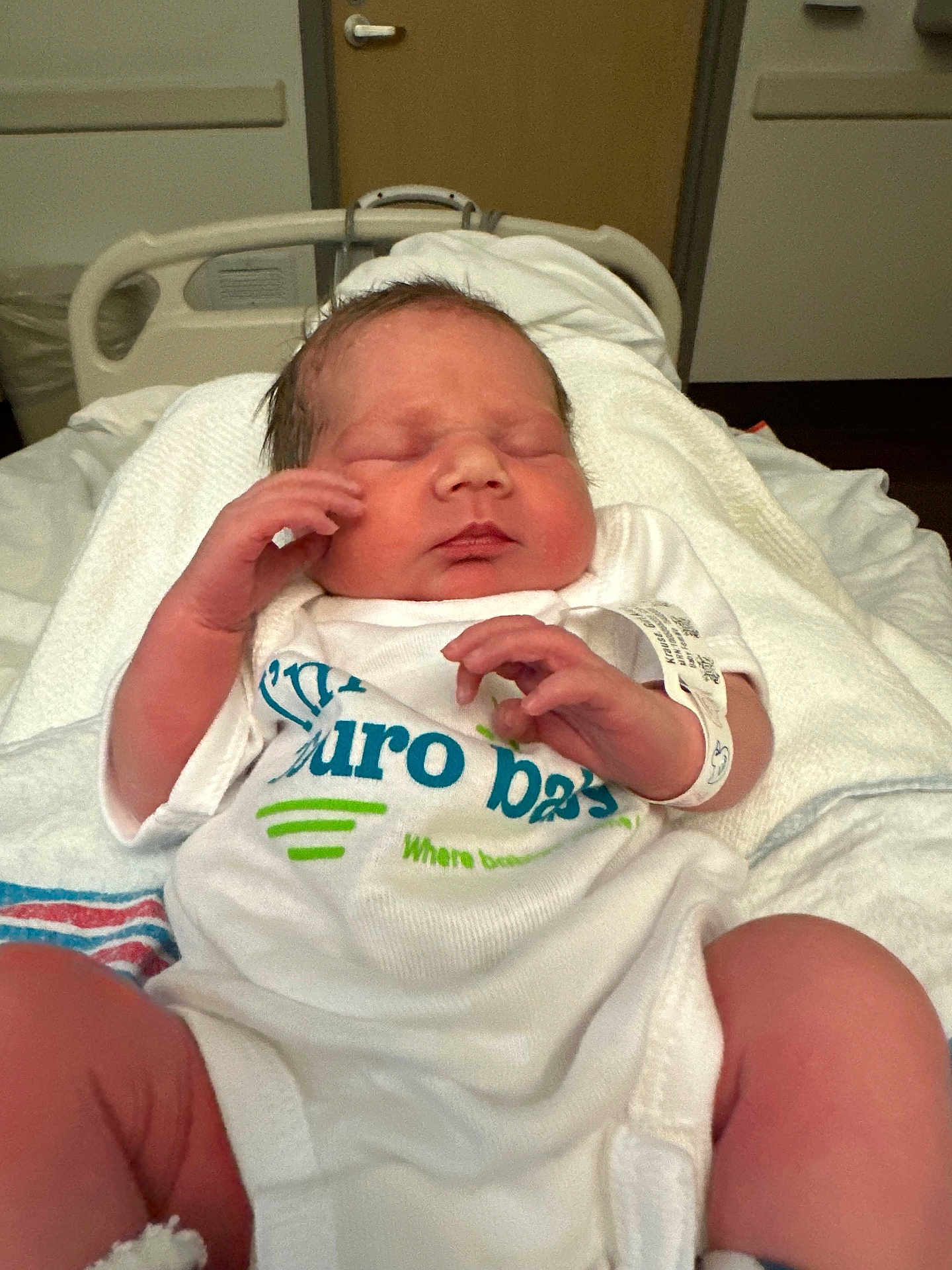 Ainsley Moate joined the competition — help win amazing prizes! newborn, baby, infant, hospital, bed, blanket, clothing, onesie, person, sleeping, face, hand, wristband, skin, indoors, healthcare, resting, cute, fresh, deliveryroom