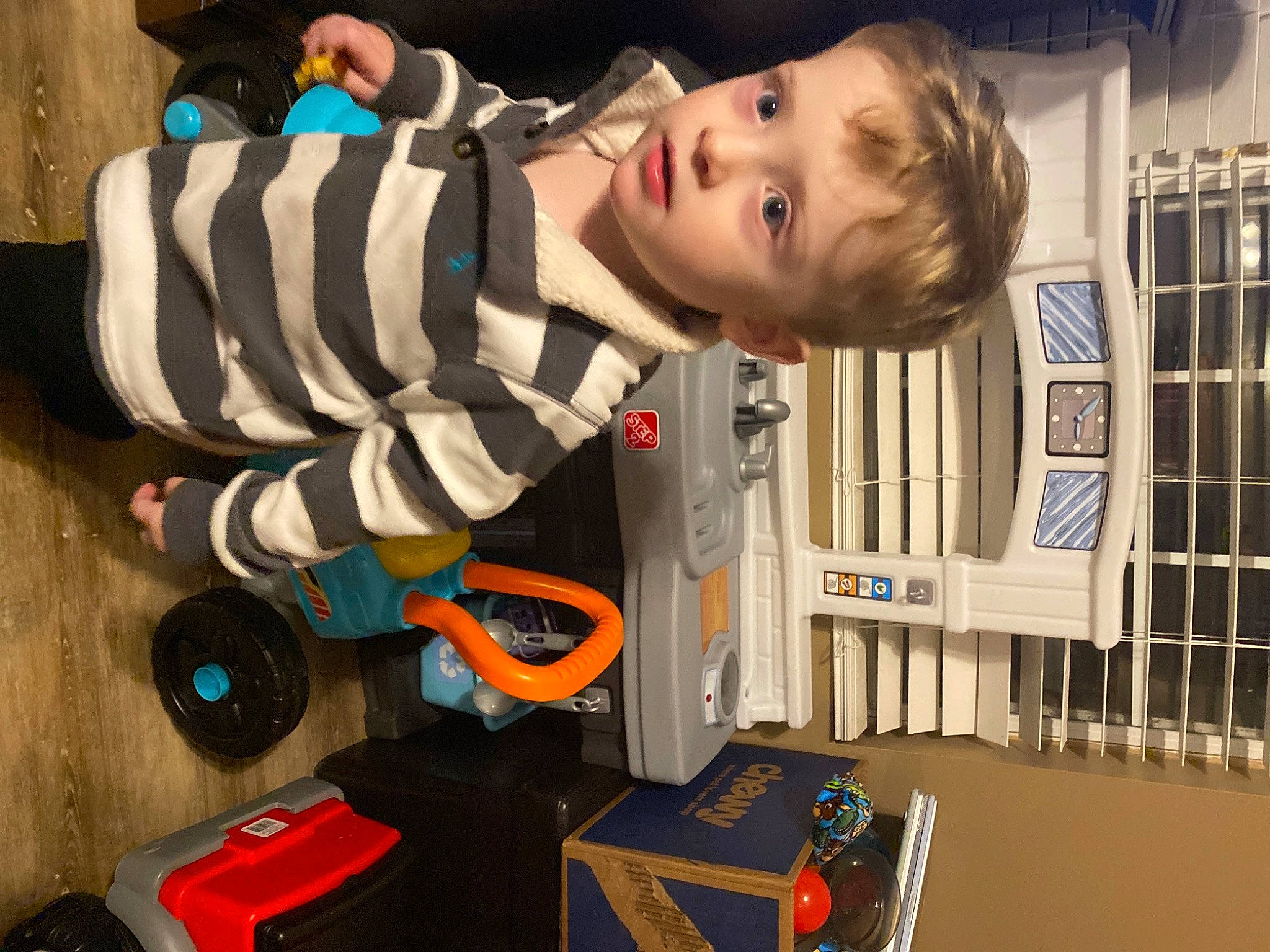 Daniell is registered to the contest to win money with this photo: audio_equipment, baby, baby_products, baby_toys, child, eye, fun, head, office_supplies, person, play, room, shipping_box, toddler, toy, wood