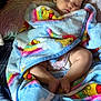 Allison joined the competition — help win amazing prizes! baby, sleeping, blanket, colorful, soft, cartoon, bed, pillow, cozy, infant, child, resting, cute, peaceful, wrapped, comfort, indoors, skin, foot, face