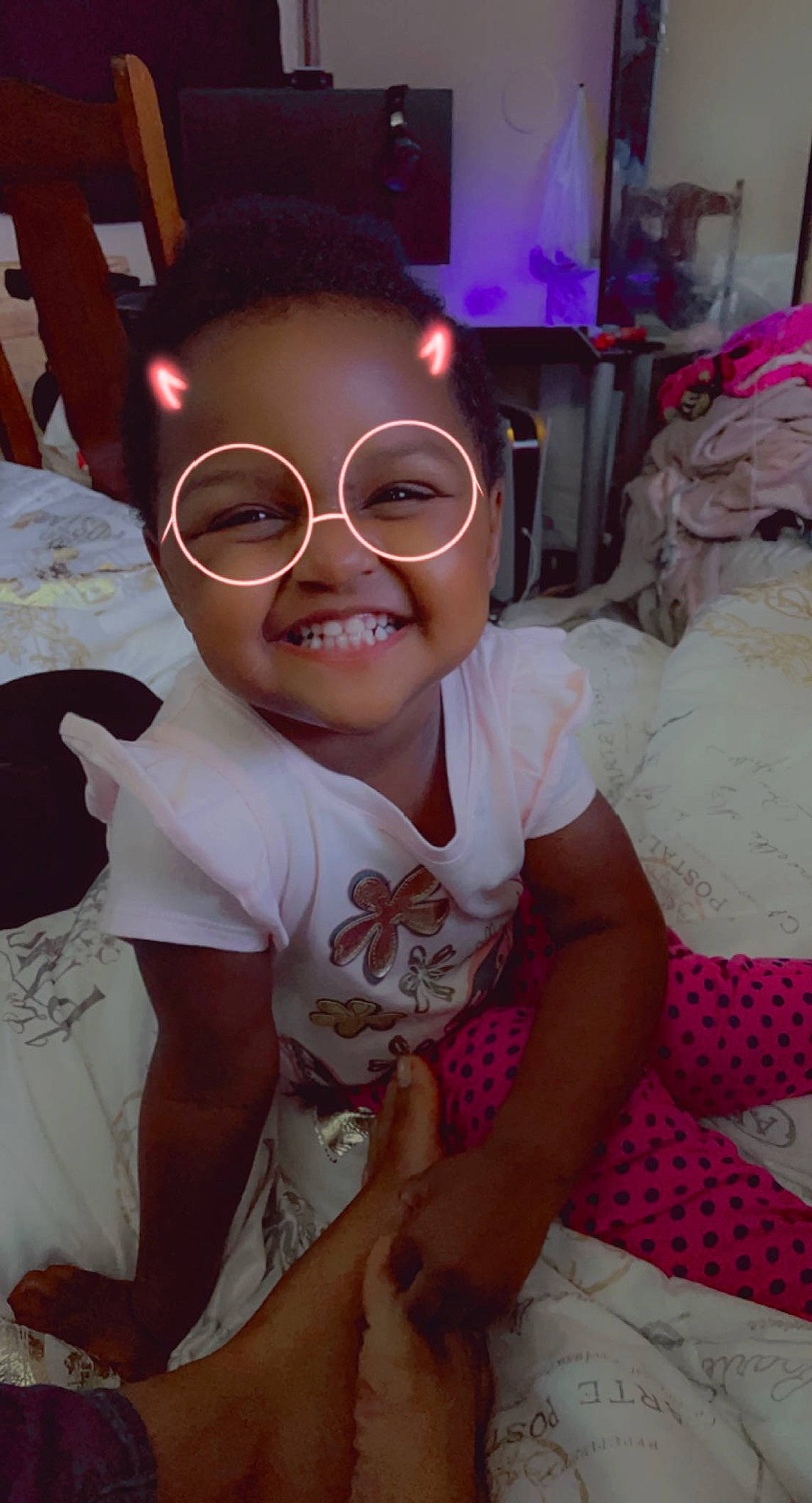 Kaliyah is registered to the contest to win money with this photo: baby_toddler_clothing, black_hair, chair, cheek, child, event, eyewear, fun, glasses, happy, head, joy, magenta, mouth, person, pink, shorts, skin, smile, sunglasses
