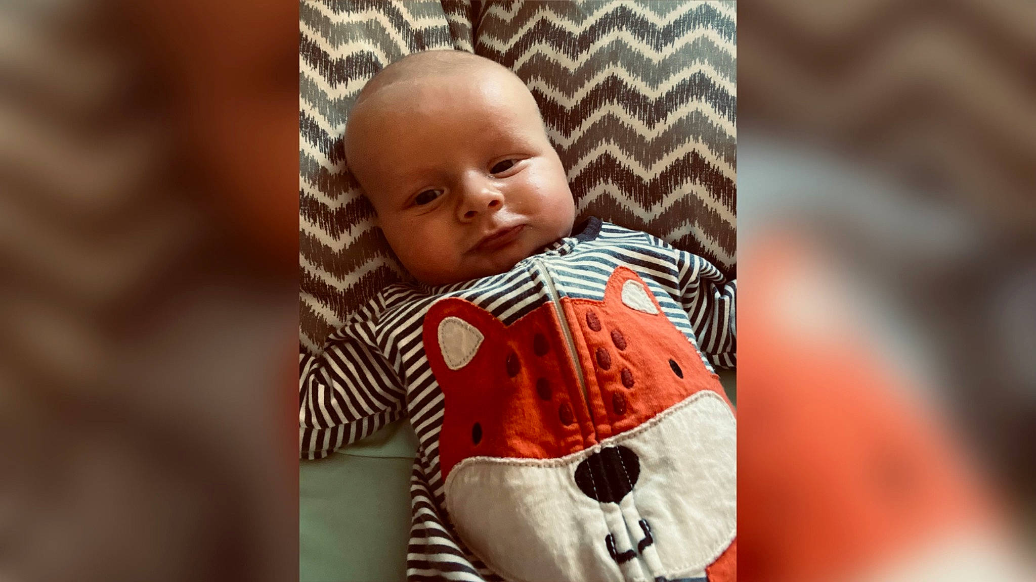 Wyatt joined the competition — help win amazing prizes! baby, baby_products, baby_toddler_clothing, carmine, cheek, child, comfort, eye, face, fashion_accessory, happy, head, iris, linens, pattern, person, portrait_photography, sitting, sleeve, toddler