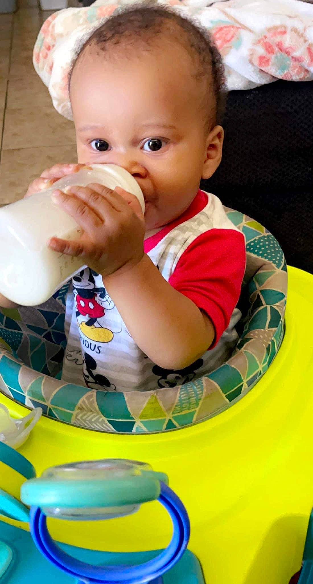 Jamir Jones is registered to the contest to win money with this photo: baby, baby_products, baby_toddler_clothing, bib, cheek, child, chin, drinkware, face, fun, green, hand, happy, head, nail, nose, person, plastic_bottle, skin, toddler