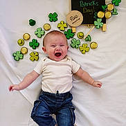 Jagger joined the competition — help win amazing prizes! baby, celebration, chalkboard, clover, cute, decoration, denim_pants, gold_coins, happy, holiday, infant, laughing, lying_down, milestone_disc, onesie, portrait, shamrocks, smiling, st_patricks_day, white_sheet