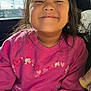 child, girl, smiling, pink_sweatshirt, barbie, car_seat, sunlight, hair, face, happy, casual_clothing, indoor, portrait, leopard_print, seatbelt, window, daylight, young, cute, clothing