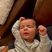 Liliana joined the competition — help win amazing prizes! arms_up, baby, blanket, child, closeup, clothing, comfort, couch, cozy, cute, furniture, indoors, infant, nap, peaceful, portrait, relaxing, resting, sleeping, soft_texture