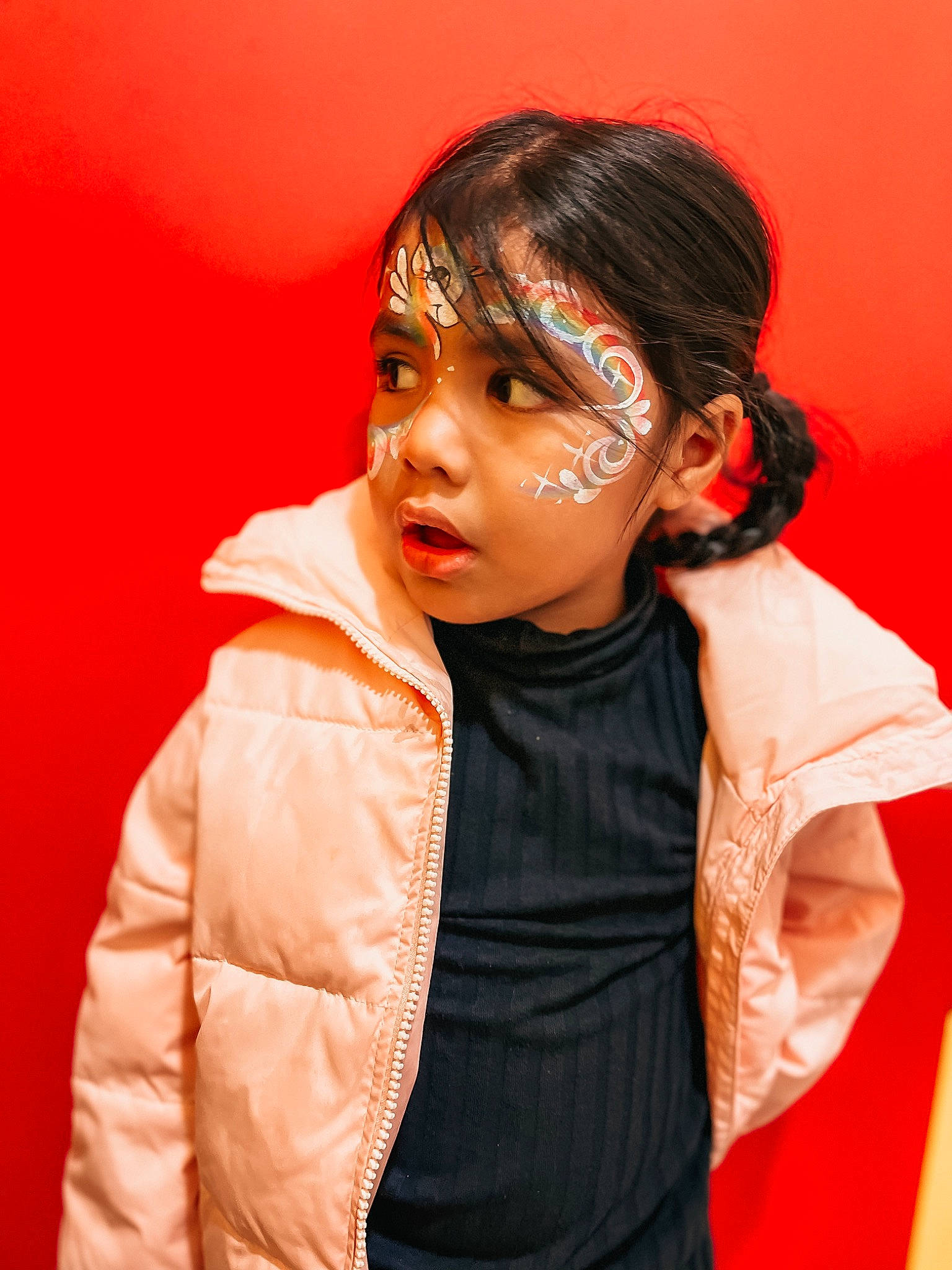 Zhailee-rae is registered to the contest to win money with this photo: audio_equipment, bangs, child, collar, eyelash, face, fashion_accessory, fashion_design, flash_photography, fur, gesture, hearing, jacket, jewellery, lip, orange, outerwear, person, portrait_photography, sleeve