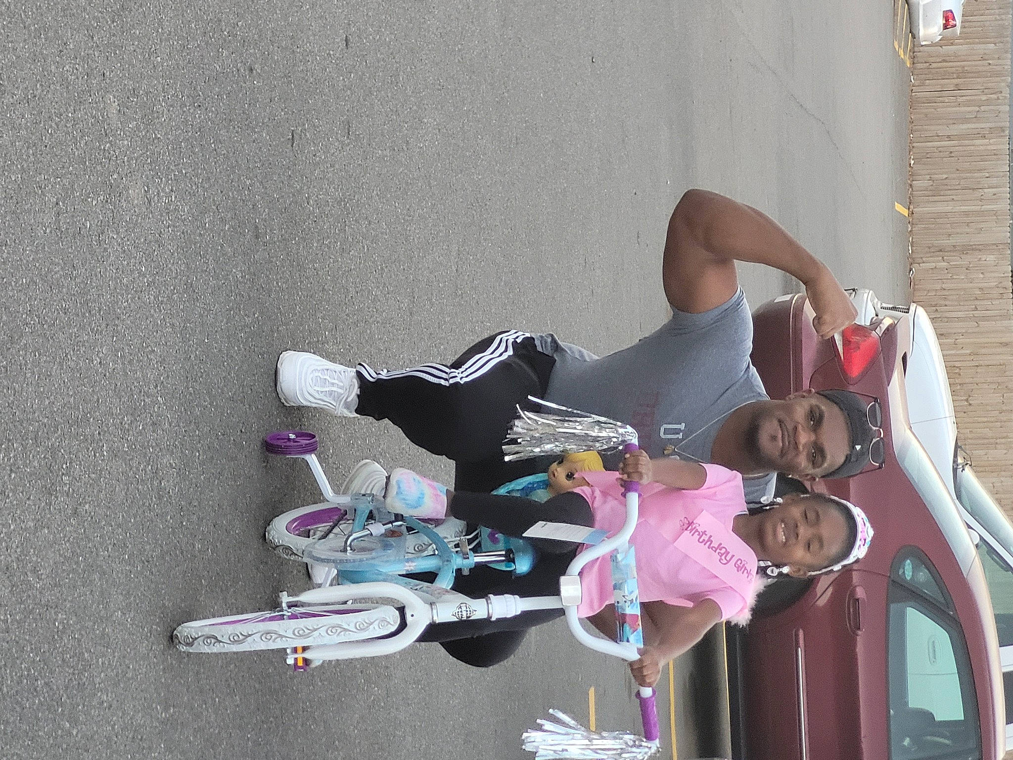 Monica is registered to the contest to win money with this photo: bicycle, bicycle_wheel, carmine, concrete, fun, headwear, joy, leisure, magenta, person, recreation, tire, toddler, vehicle, wheel