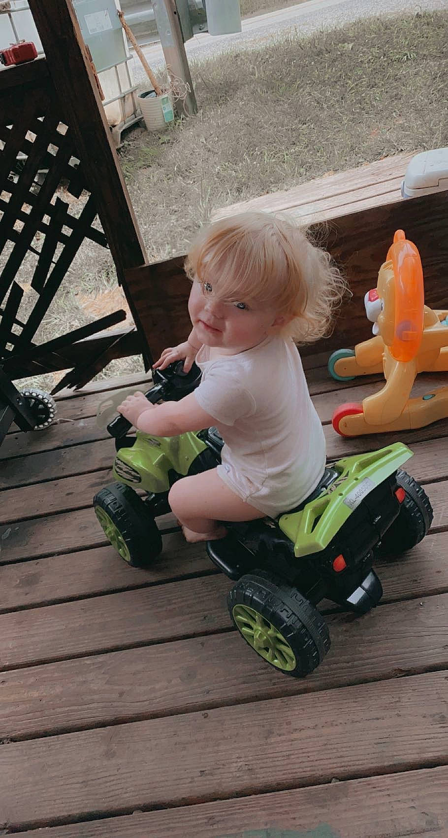 Grayson joined the competition — help win amazing prizes! chair, child, flooring, fun, grass, hardwood, leg, leisure, outdoor_furniture, person, product, riding_toy, rolling, sneakers, tire, toddler, toy, vehicle, wheel, white