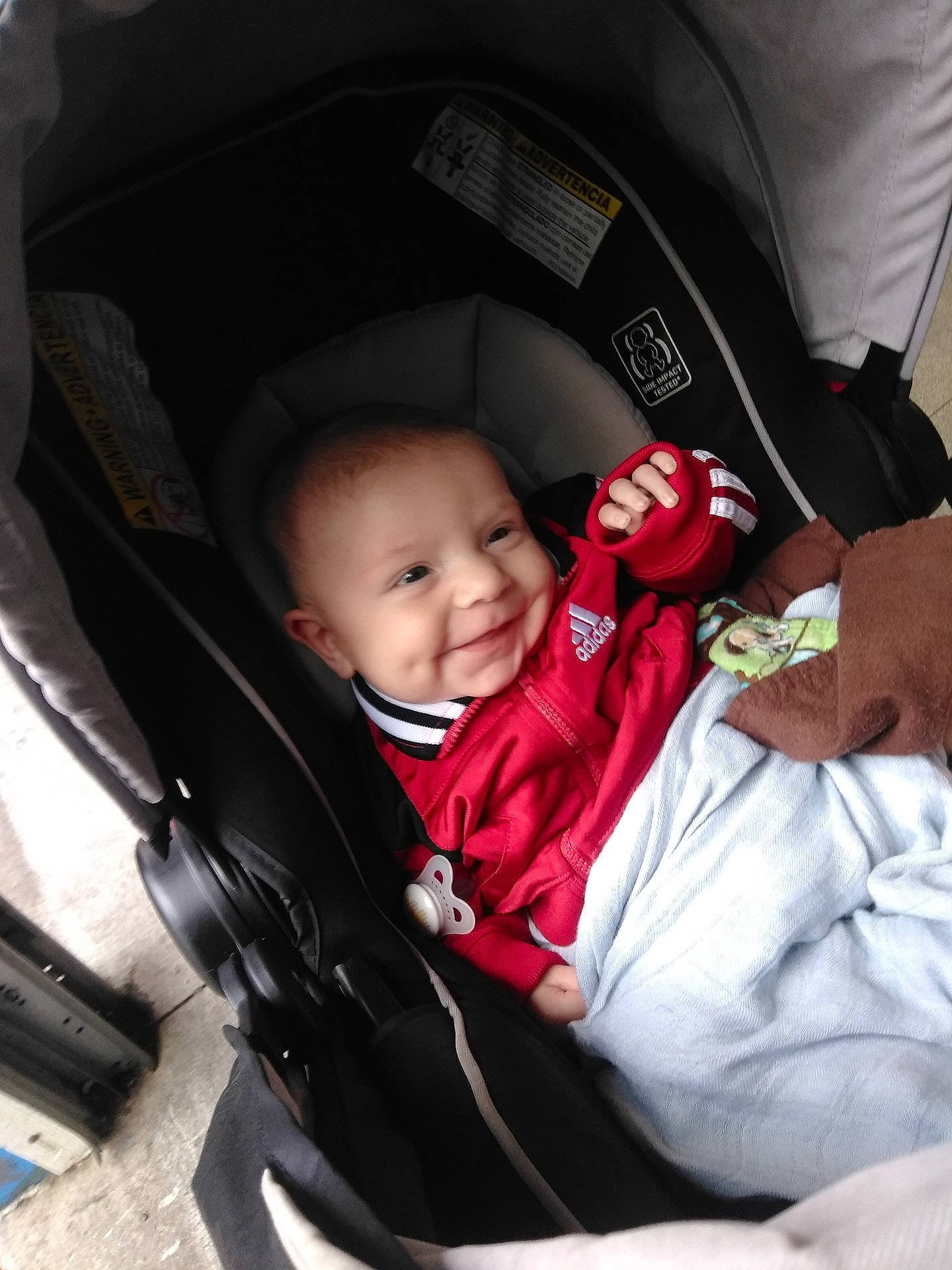 Lucca is registered to the contest to win money with this photo: baby_carriage, baby_products, car, car_seat, child, cool, day, fun, infant, joy, person, product, smile, toddler, vehicle