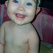 Hayzleigh is registered to the contest to win money with this photo: baby, blue_eyes, child, chubby, closeup, cute, diaper, expression, face, happy, headband, indoor, infant, joyful, person, portrait, sitting, skin, smile, young_child