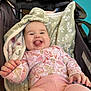 Hayzleigh joined the competition — help win amazing prizes! baby, infant, smiling, tongue_out, stroller, blanket, pink_clothing, floral_pattern, cheeks, hand, cozy, portrait, indoors, car_seat, happy, cute, fabric, head, eyes, playful