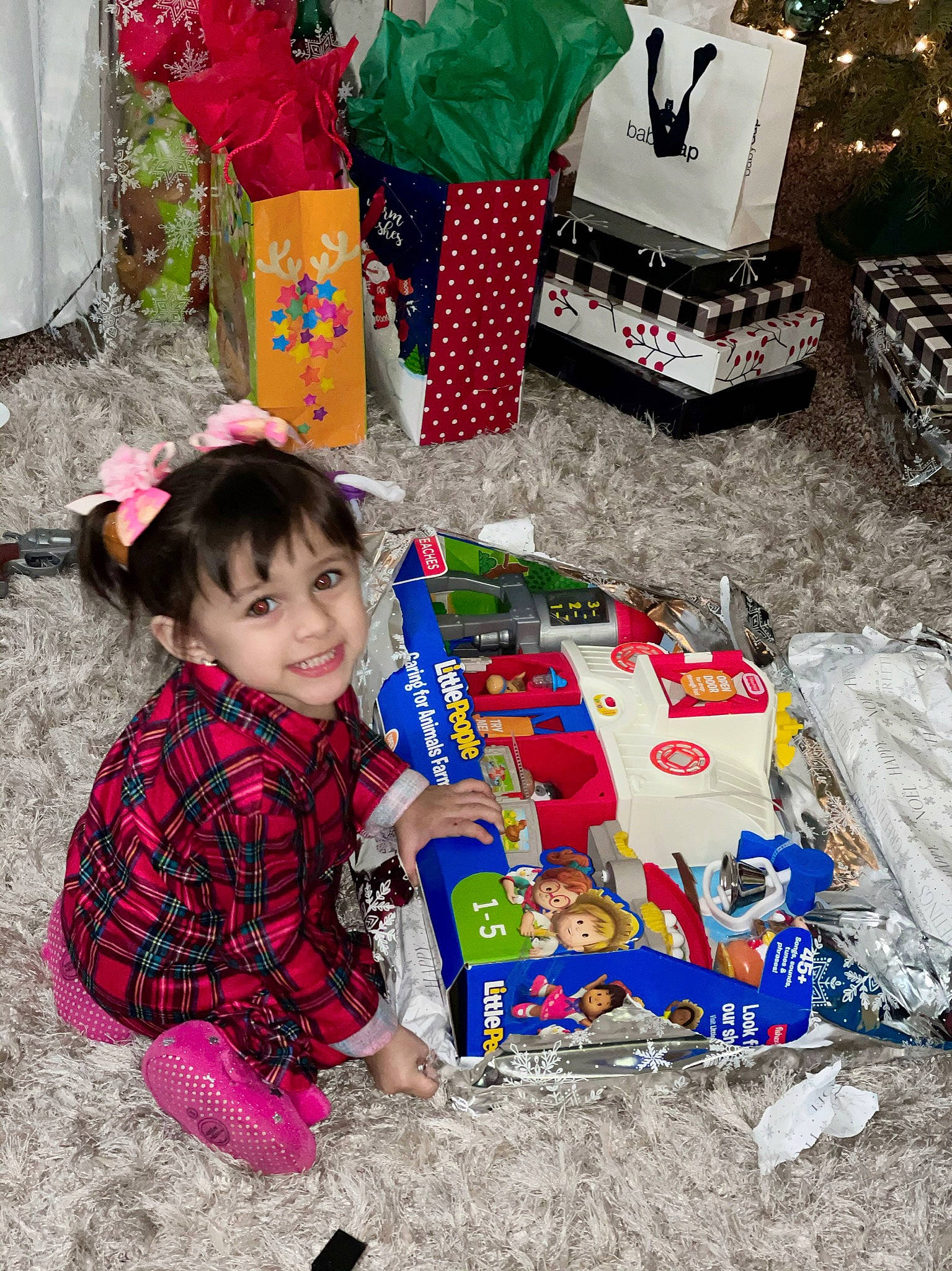 Jakayla is registered to the contest to win money with this photo: baby_toddler_clothing, child, christmas, christmas_decoration, christmas_eve, decoration, event, fun, happy, holiday, joy, pattern, person, play, present, red, sharing, sitting, smile, textile